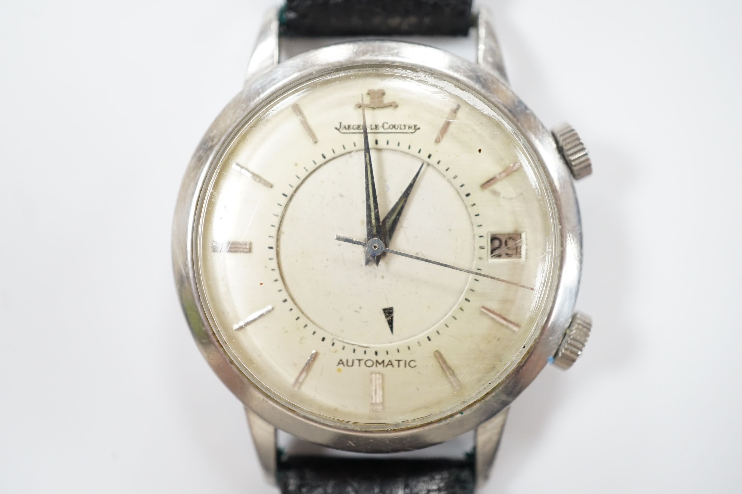 A gentleman's stainless steel Jaeger LeCoultre Memovox automatic 'oversize' wrist watch, with baton numerals and date aperture, case diameter 37mm, case back numbered 860368 on associated leather strap, no box or papers.